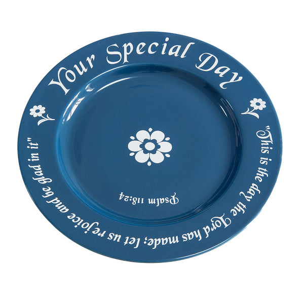 Blue plate with white text and floral design on a white background