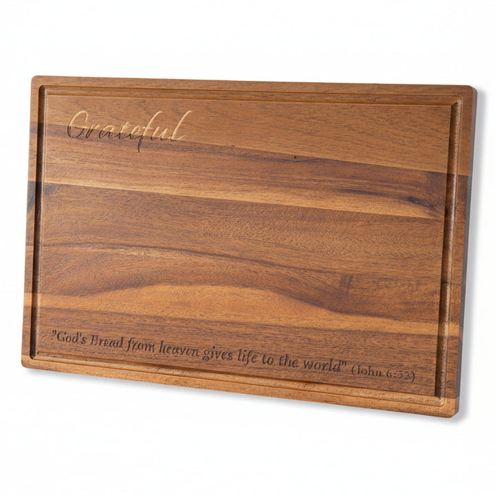 Wooden cutting board with engraved text "Grateful" and scripture "John 6:33" on a white background